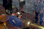 Looking down on the busker is...