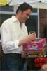 Ed shows his delight on winning Cindarella's shoe...