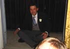 Pete cross-legged in his mourning suit