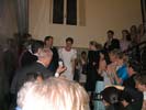 Descending the staircase lined with wedding guests